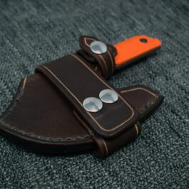 A Leather Scout Sheath for the Benchmade Nestucca Cleaver with two metal buttons on it.