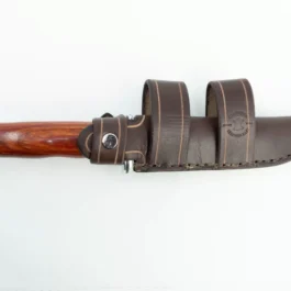 A Buck 105 with a handmade leather sheath and a wooden handle.