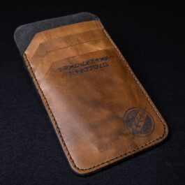 The Bounty Hunter "Mathias" Wallet sitting on top of a black table.