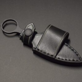a black Handmade Leather Sheath for the Benchmade Mini SOCP Dagger keychain with a leather strap.