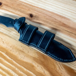 A Leather Sheath for the Benchmade Fixed Contego on a Wooden Table.
