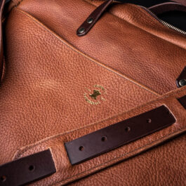 A Horween Leather Briefcase Satchel with a brown strap.