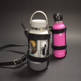 a pink and black Water Bottle Holster next to a pink and white Water Bottle Holster.