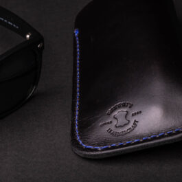 A Eyeglasses Slip and a leather case.