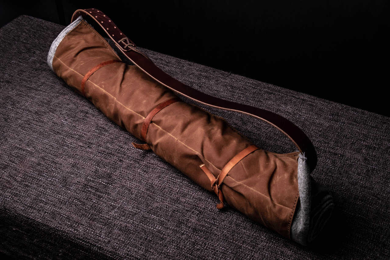 A Ranger Bedroll sitting on top of a couch.
