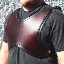 A man wearing a Brown Leather Short Cuirass standing in front of a brick wall.
