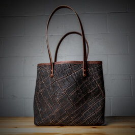 a tote bag made out of brown elephant leather
