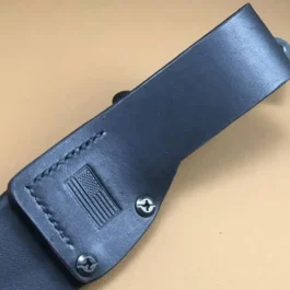 A vertical leather loop attached to a kydex sheath